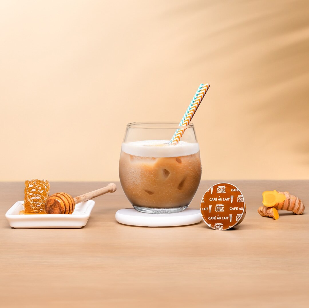 iced coffee in a glass with a straw